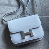  Timeless top-handle bag carried on shoulder