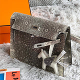 Side view of clean-lined structured handbag
