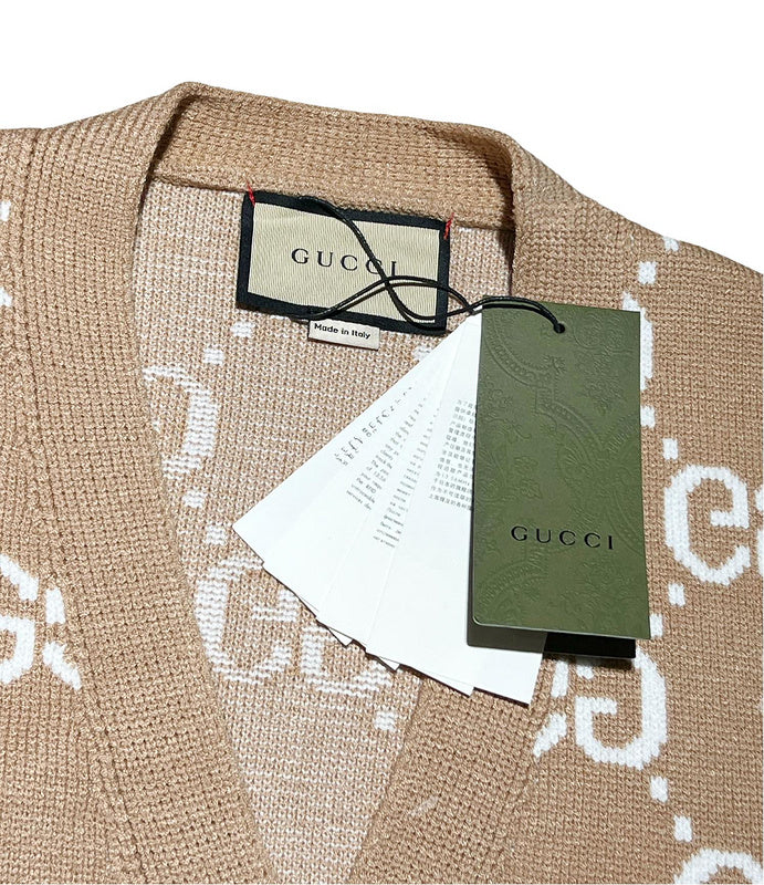 Flat lay presentation of Gucci luxury clothing with monogram-inspired silhouette