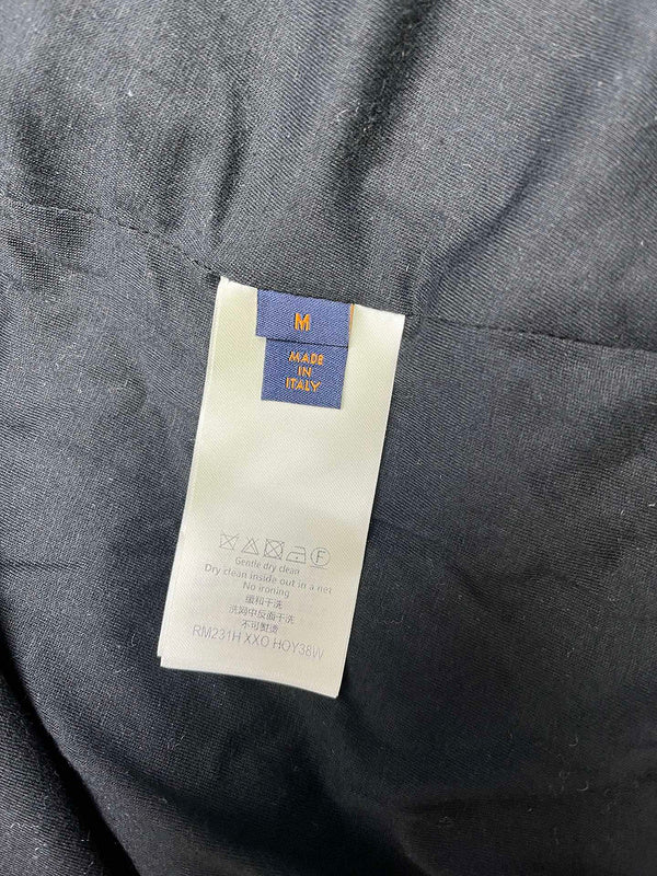 Side profile of Louis Vuitton luxury clothing with logo-detail design