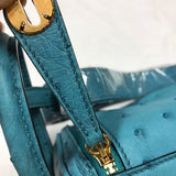 Side view of curated structured handbag