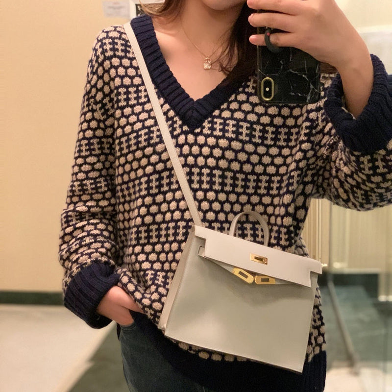 Side view of curated structured handbag
