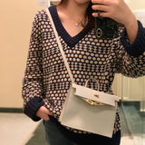 Side view of curated structured handbag
