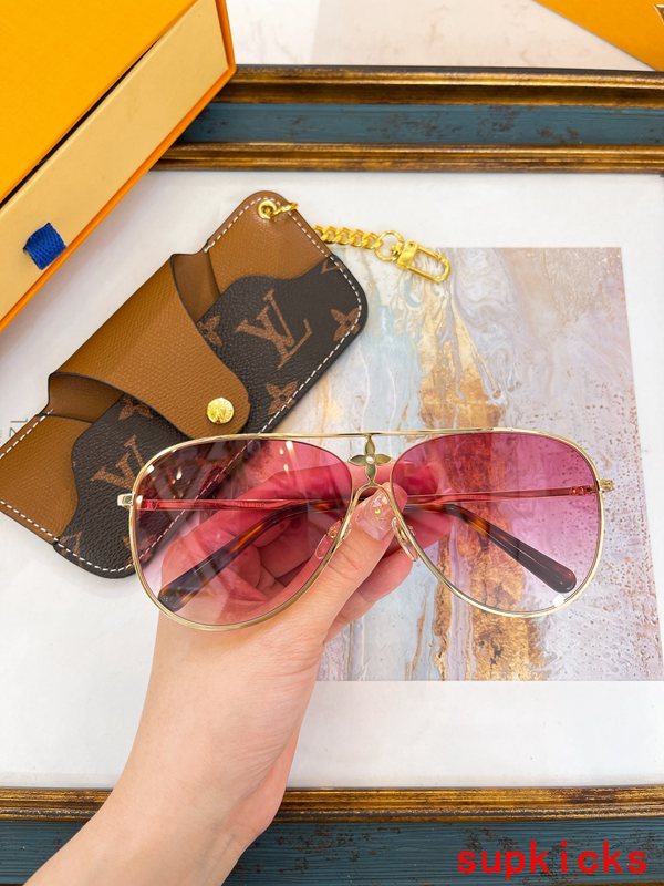 Close-up detail view of Louis Vuitton unisex sunglasses