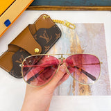 Close-up detail view of Louis Vuitton unisex sunglasses
