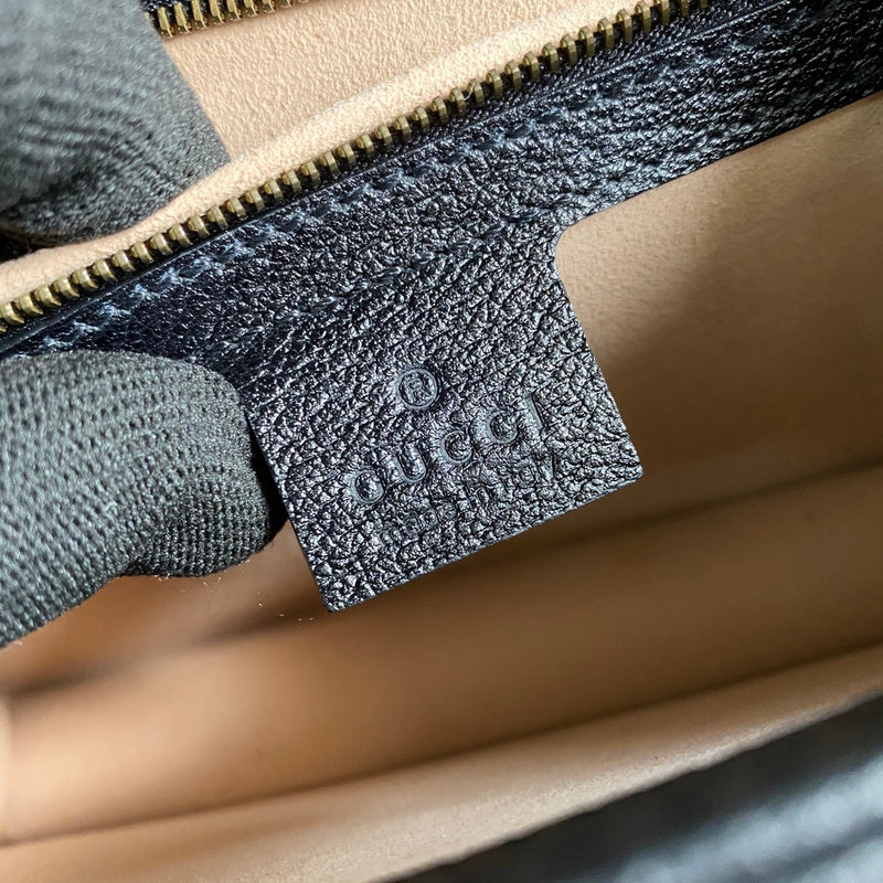 Side profile of structured everyday-luxe women's handbag – women's designer-style accessory
