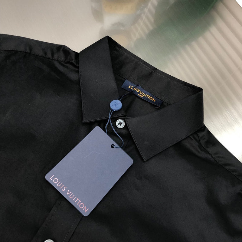 Close-up detail shot of Louis Vuitton luxury clothing with monogram-inspired silhouette