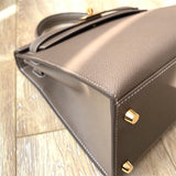  Curated handbag carried on shoulder