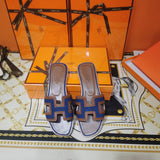Hermès Beige Slide Sandals - Close-Up Texture View