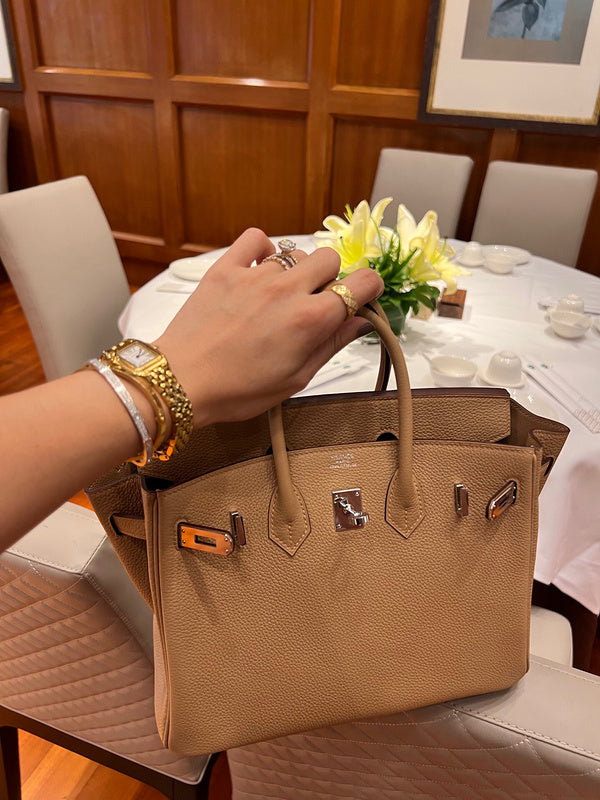 Side view of sculpted structured handbag