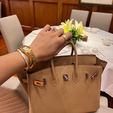 Side view of sculpted structured handbag