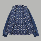 Close-up detail shot of Louis Vuitton luxury clothing with monogram-inspired silhouette