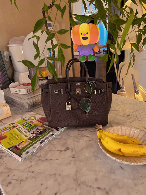 Side view of tailored structured handbag