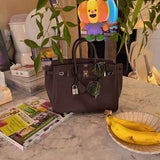 Side view of tailored structured handbag