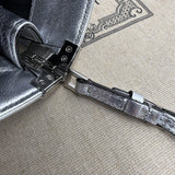 Handle and strap detail of classic refined women's handbag – women's everyday handbag
