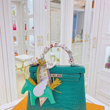 Side view of streamlined structured handbag