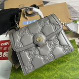Handle and strap detail of statement structured women's handbag – women's designer-style accessory