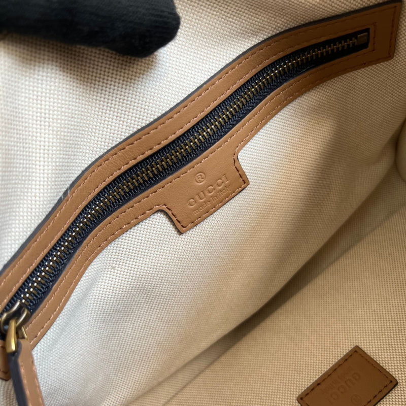 Side profile of polished elevated women's handbag – women's luxury handbag