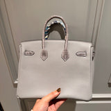 Side view of sleek structured handbag