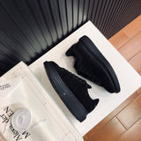 Alexander McQueen tonal black luxury sneakers view 10 classic court silhouette
