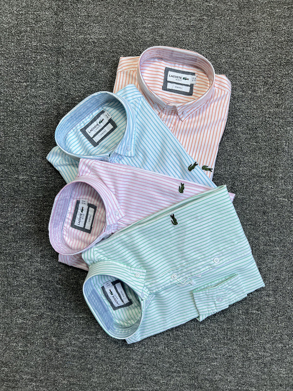 Flat lay presentation of Lacoste luxury clothing with logo-detail design