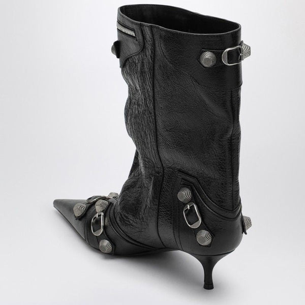 Close-up of Balenciaga boots hardware and fine stitching