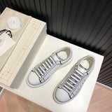 Alexander McQueen soft grey luxury sneakers view 10 chunky sole construction