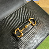 Close-up detail of structured classic women's handbag – women's luxury accessory