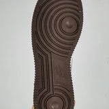Side profile of Nike muted earth tones sneakers cushioned comfort fit