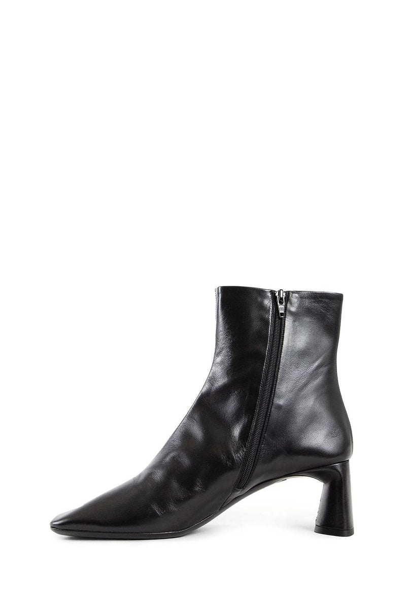 Close-up of Balenciaga boots hardware and fine stitching