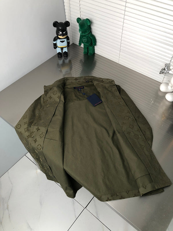 Flat lay presentation of Louis Vuitton luxury clothing with signature branding