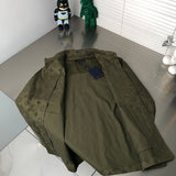Flat lay presentation of Louis Vuitton luxury clothing with signature branding