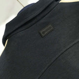 Back view of Louis Vuitton luxury clothing with tailored silhouette
