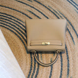 Side view of streamlined structured handbag