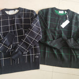 Side profile of Lacoste luxury clothing with signature branding