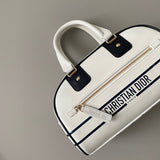 Close-up detail of signature everyday-luxe women's handbag – women's designer-style accessory