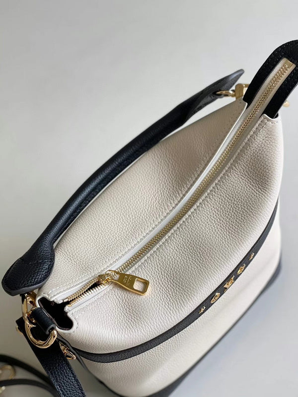Handle and strap detail of everyday-luxe modern women's handbag – women's luxury accessory