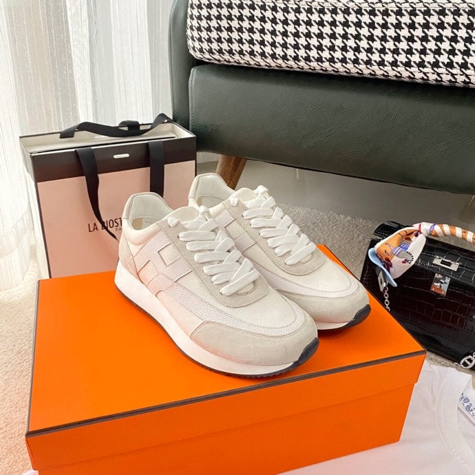 Hermès Beige Loafer Flats - Angled View
