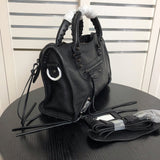 Handle and strap detail of structured polished women's handbag – women's luxury handbag
