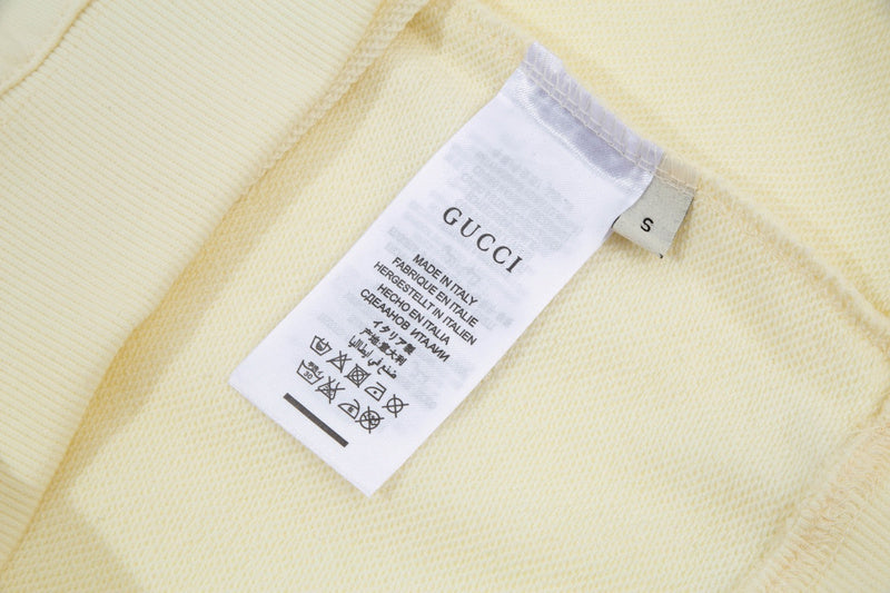 Close-up detail shot of Gucci luxury clothing with tailored silhouette