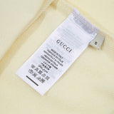 Close-up detail shot of Gucci luxury clothing with tailored silhouette