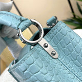  clean-lined handbag detail view showing craftsmanship 32