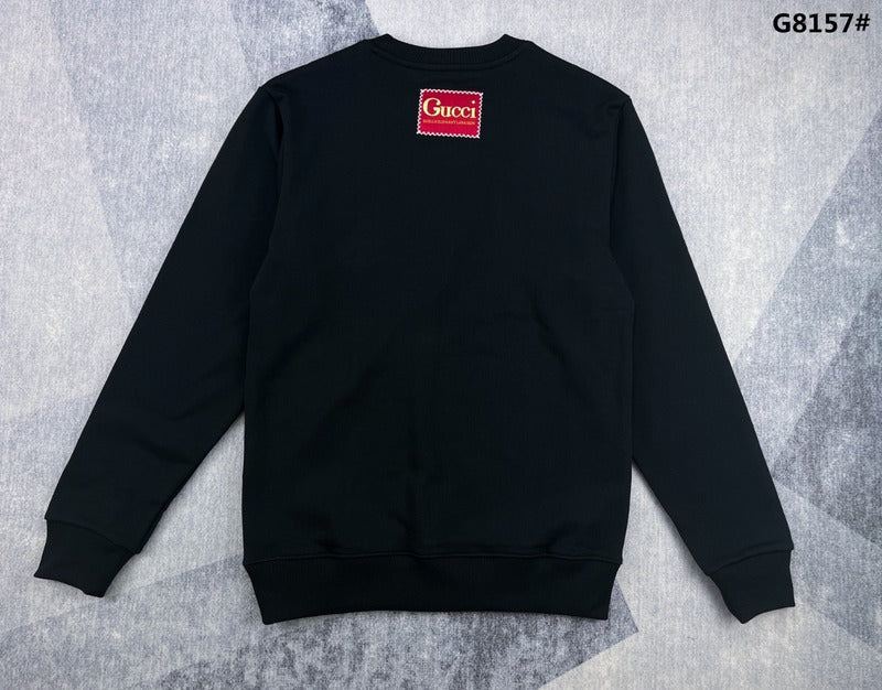 Side profile of Gucci luxury clothing with signature branding