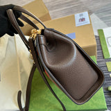 Side profile of refined modern women's handbag – women's luxury accessory