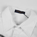 Flat lay presentation of Louis Vuitton luxury clothing with logo-detail design