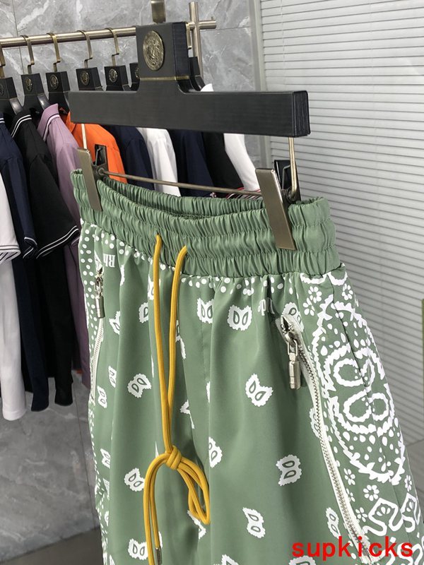 Flat lay presentation of Rhude luxury clothing with runway-inspired design