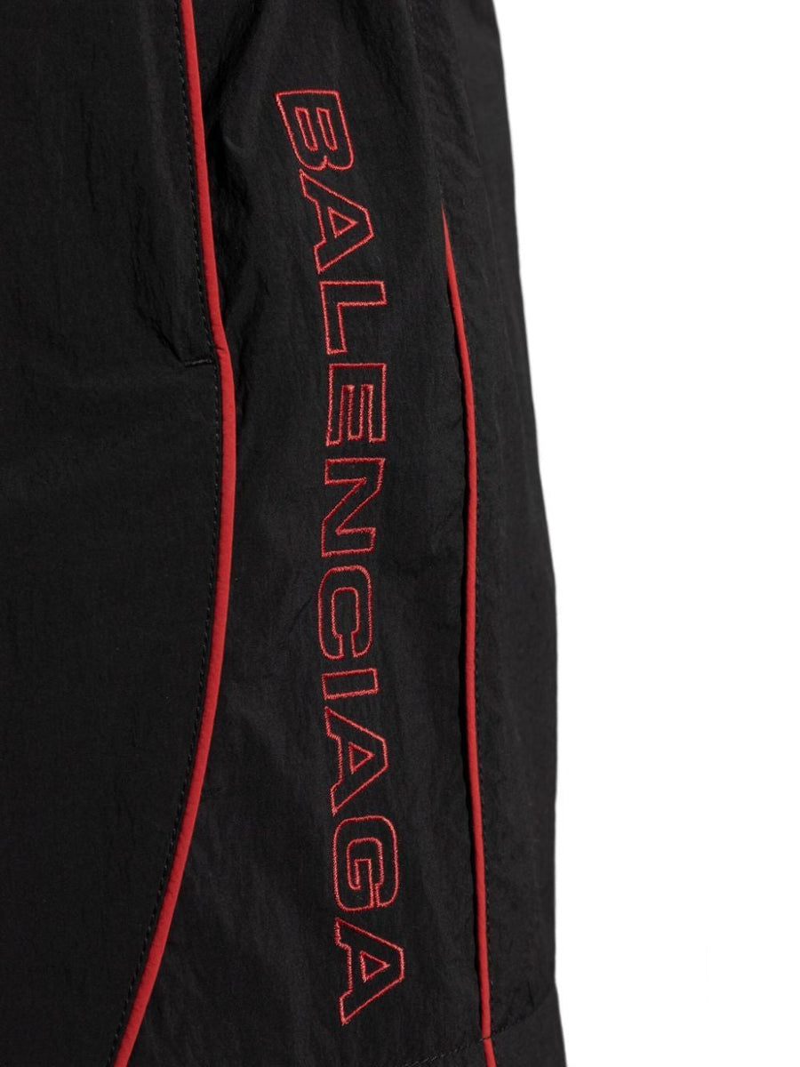 Close-up of Balenciaga pants hardware and fine stitching