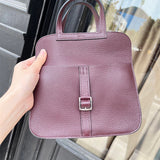  timeless top-handle bag styled with outfit