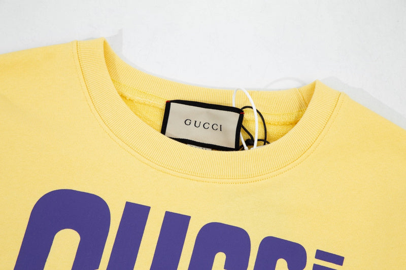 Close-up detail shot of Gucci luxury clothing with signature branding