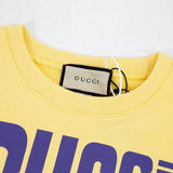 Close-up detail shot of Gucci luxury clothing with signature branding